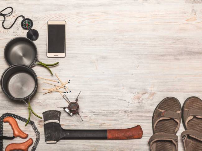 Equipment of hiking gear on floor background
