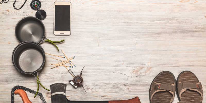 Equipment of hiking gear on floor background